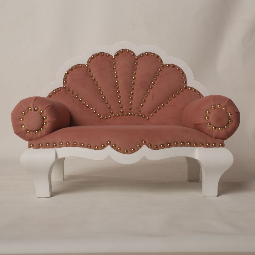 A luxurious royal sofa baby prop with intricate detailing and plush cushioning, designed for newborn and sitter photoshoots, offering an elegant and comfortable setting for capturing regal baby portraits.
