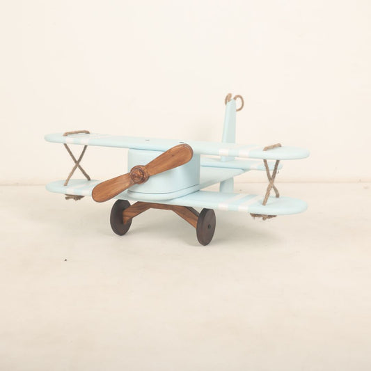 A vintage-style biplane baby prop crafted for baby photoshoots. The wooden biplane features detailed wings, a miniature propeller, and a distressed finish for a classic look. Its cozy seating area is perfect for posing babies, adding a touch of adventure and nostalgia to the photoshoot.