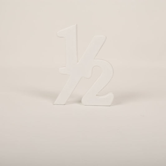 Adorable Half Birthday Prop showcasing '½' for six-month baby milestone photoshoots.