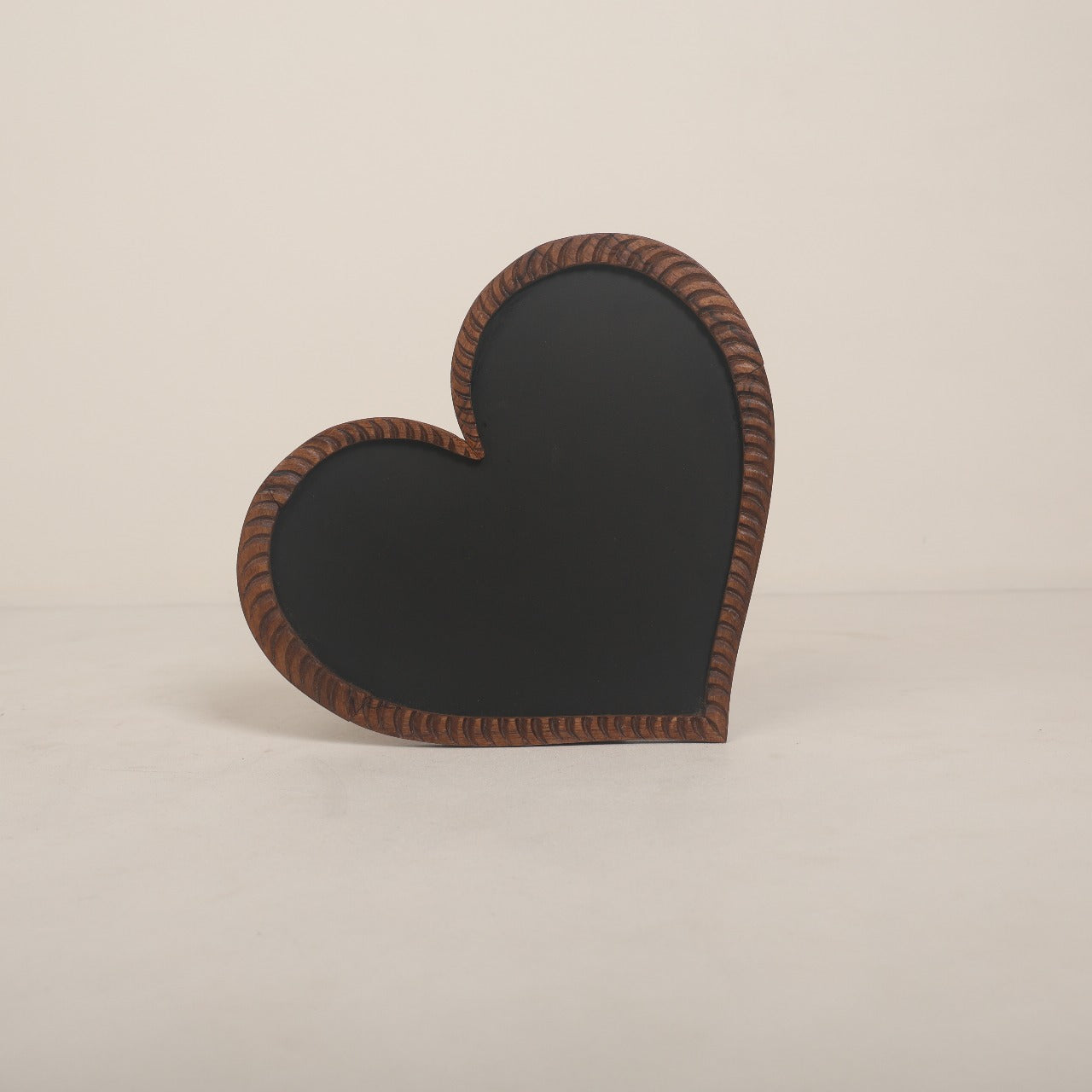 Heart-shaped wooden signage prop for maternity photography, featuring customizable messages like 'It's a Boy,' 'It's a Girl,' or 'Promoted to Big Brother/Sister.