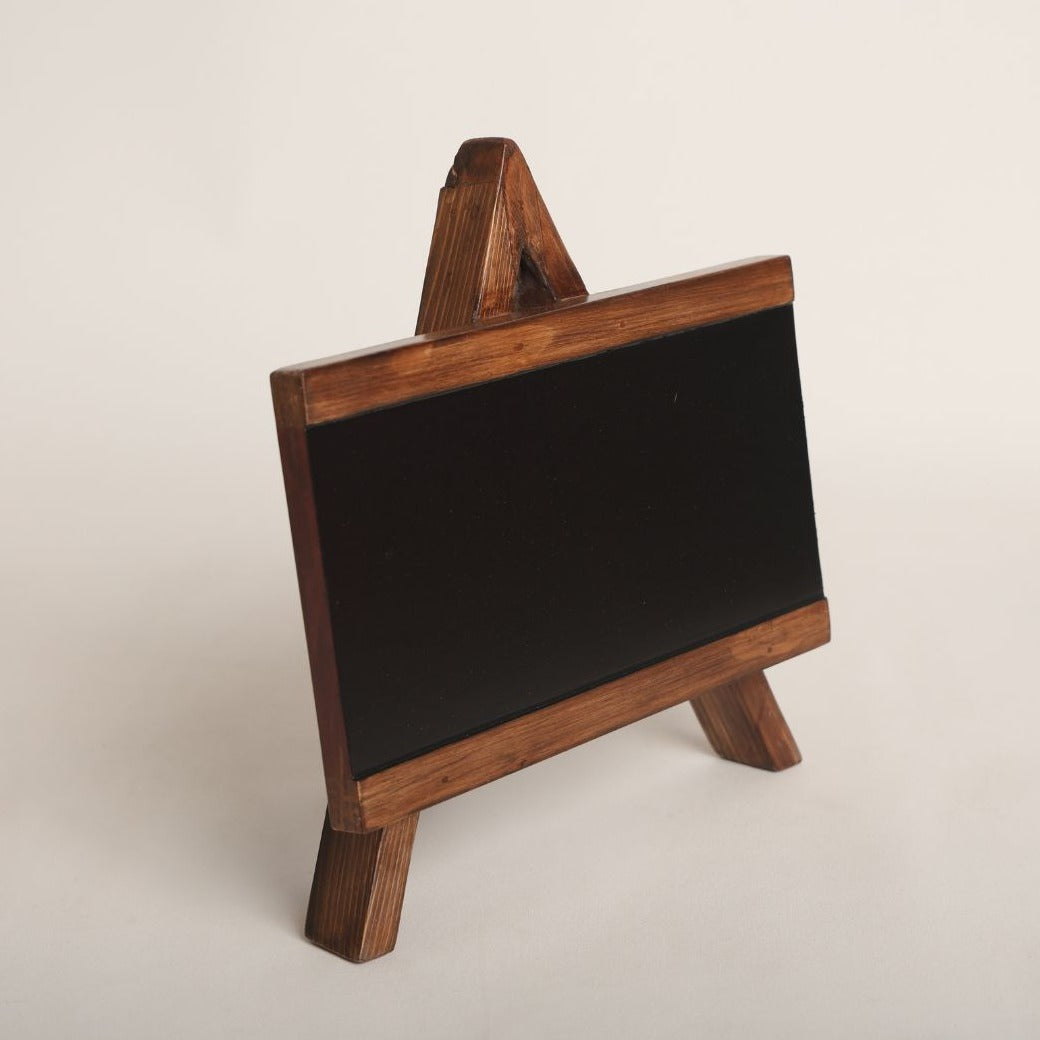 Blackboard Baby Photoshoot Prop: A charming Blackboard baby photoshoot prop featuring a smooth black surface and wooden frame, ideal for personalized messages or milestone markers in creative photoshoot setups.