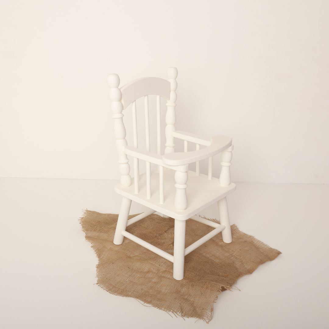 Elegant baby chair prop with arms, designed for newborn and sitter photoshoots, perfect for capturing charming and cozy baby portraits.