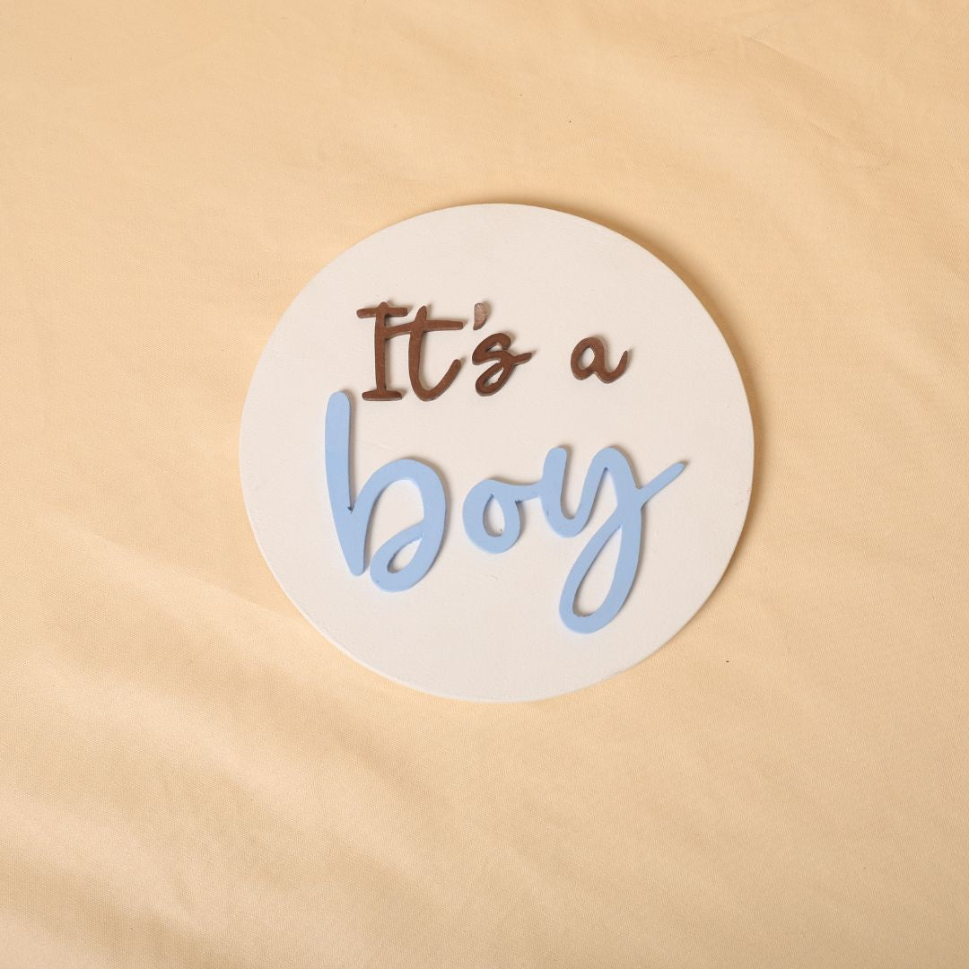 Gender reveal prop for maternity photoshoot featuring 'It's a Boy' and 'It's a Girl' signs, perfect for expecting mothers