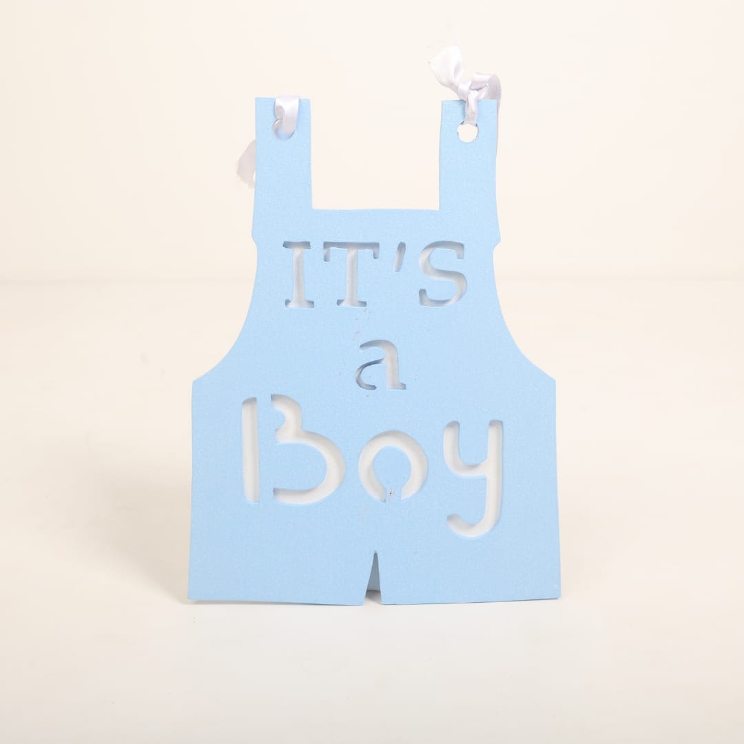 A chic "It's a Boy" sign styled with blue and neutral tones, ideal for maternity photoshoots and gender reveal celebrations.