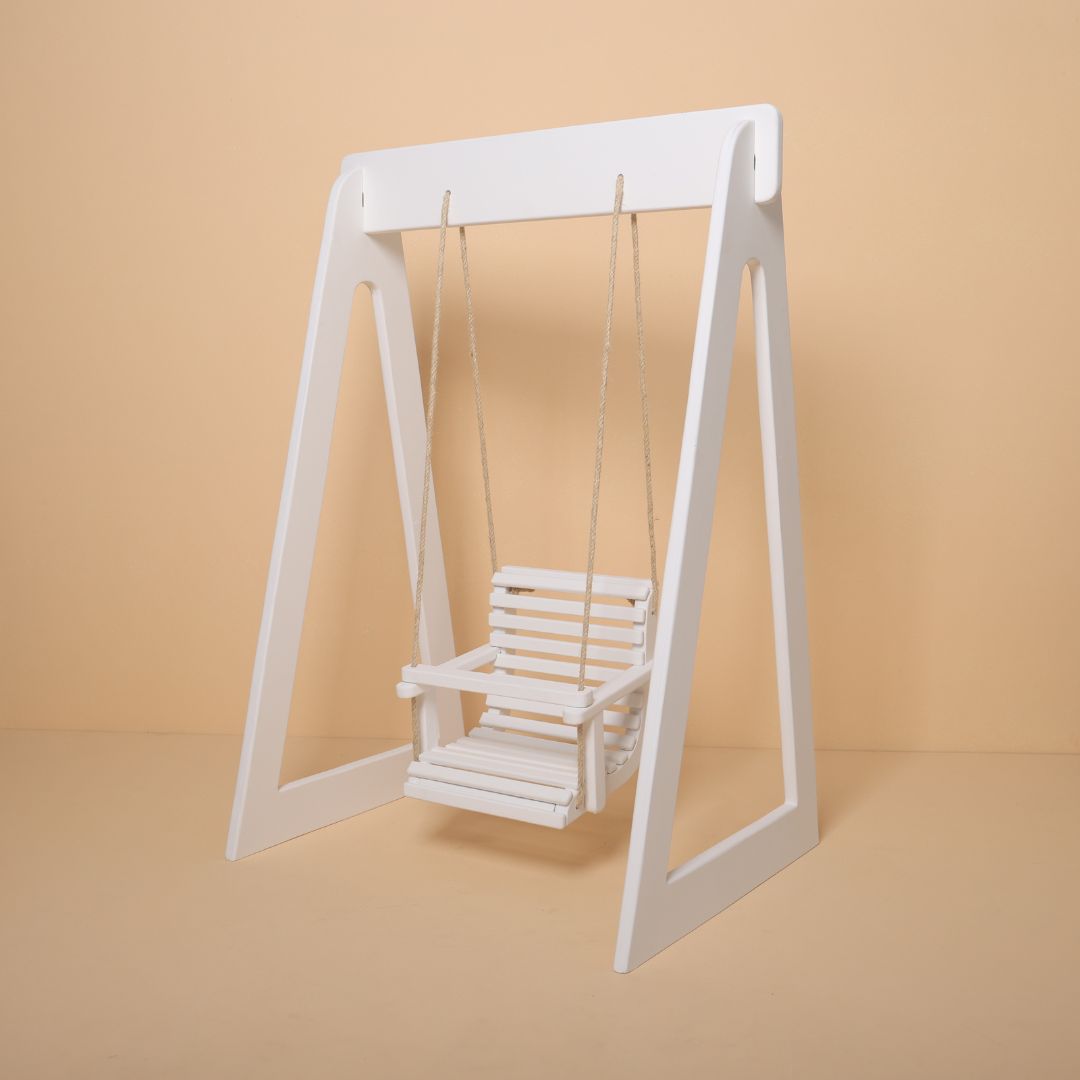 Krishna Janmashtami themed wooden swing baby photoshoot prop in festive setup