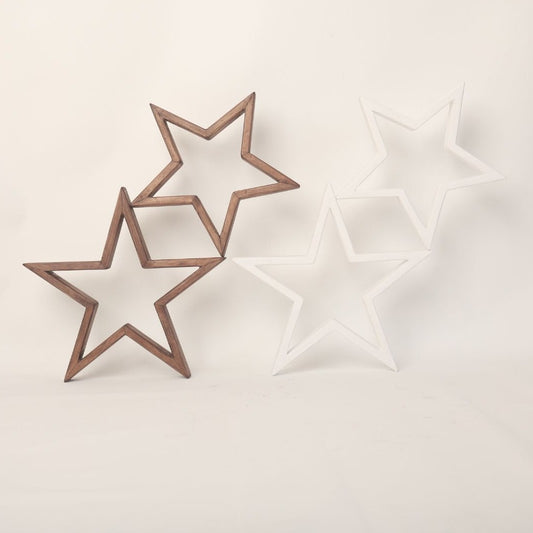 An arrangement of wooden stars, painted in soft pastel colors, hangs delicately above a baby's crib. Each star is intricately crafted, with visible wood grain adding texture to the surface. The stars are suspended by thin, transparent strings, creating a whimsical and enchanting display. Soft light casts gentle shadows on the wall behind, creating a serene and cozy atmosphere. This charming baby prop adds a touch of rustic elegance to any nursery, inviting dreams and imagination to flourish.