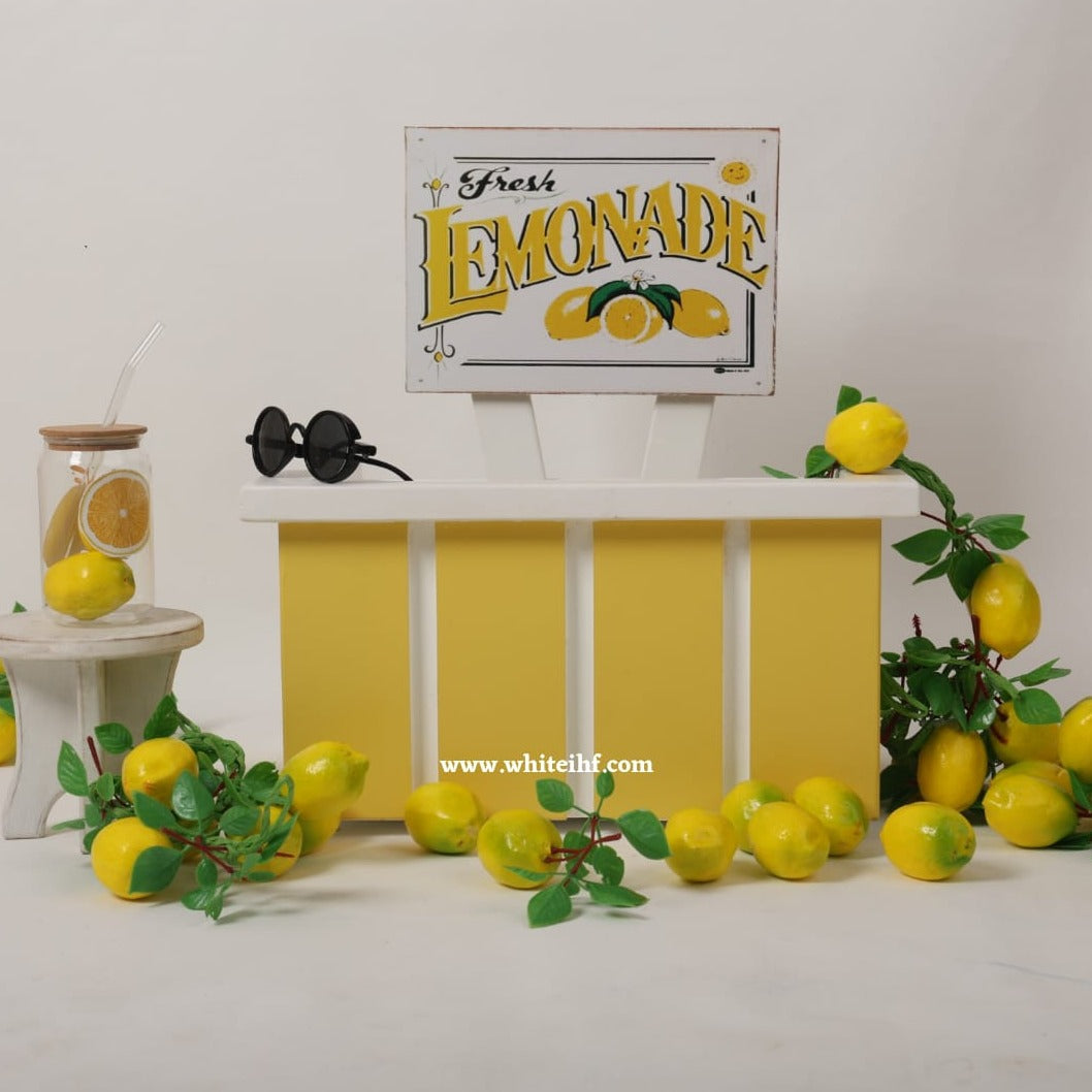 Charming lemonade cart prop for newborn and sitter baby photoshoots, featuring vibrant colors and a cheerful summer theme.