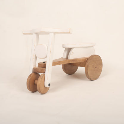 A colorful scooter baby prop used for adorable baby photoshoots, showcasing vibrant colors and a playful design. Perfect for capturing precious moments.