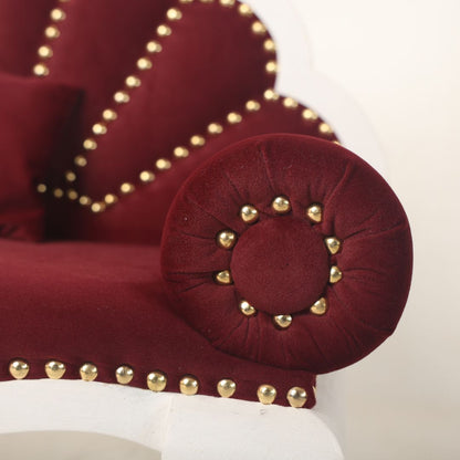 A luxurious royal sofa baby prop with intricate detailing and plush cushioning, designed for newborn and sitter photoshoots, offering an elegant and comfortable setting for capturing regal baby portraits.