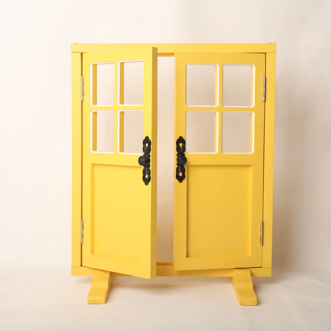 A vibrant yellow door prop designed for baby photoshoots, standing upright with a playful charm. The bright color adds warmth and cheer, making it an ideal backdrop for capturing adorable moments with newborns and toddlers.