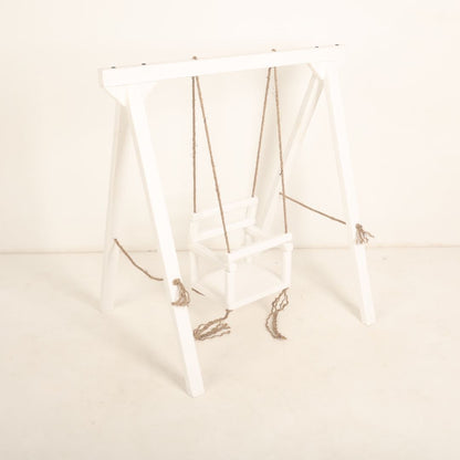 Wooden swing baby prop with soft cushions and decorative ropes, designed for newborn and toddler photoshoots, adding a playful and whimsical charm to any setup.