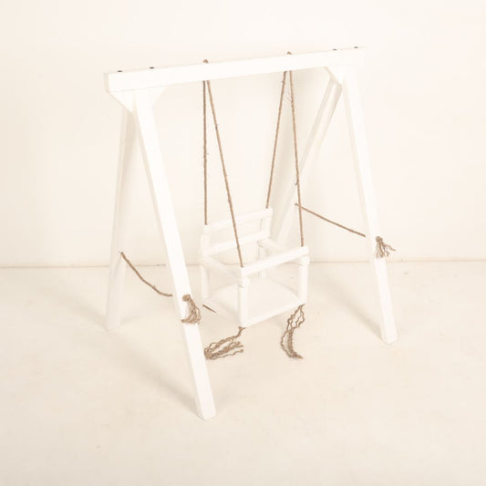 Wooden swing baby prop with soft cushions and decorative ropes, designed for newborn and toddler photoshoots, adding a playful and whimsical charm to any setup.