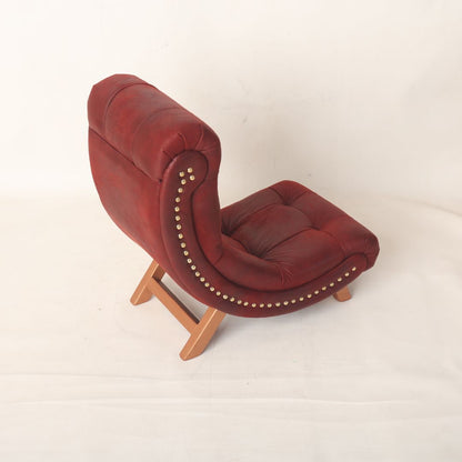 Crescent moon-shaped baby photography prop with a soft cushioned seat, designed in a light pastel color. Ideal for baby photoshoots, the prop is styled to create a dreamy, celestial-themed setting.