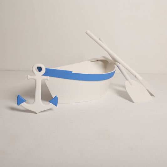 Adorable boat baby prop with a charming anchor accessory, perfect for nautical-themed baby photoshoots. A delightful setup to capture precious memories of your little sailor!
