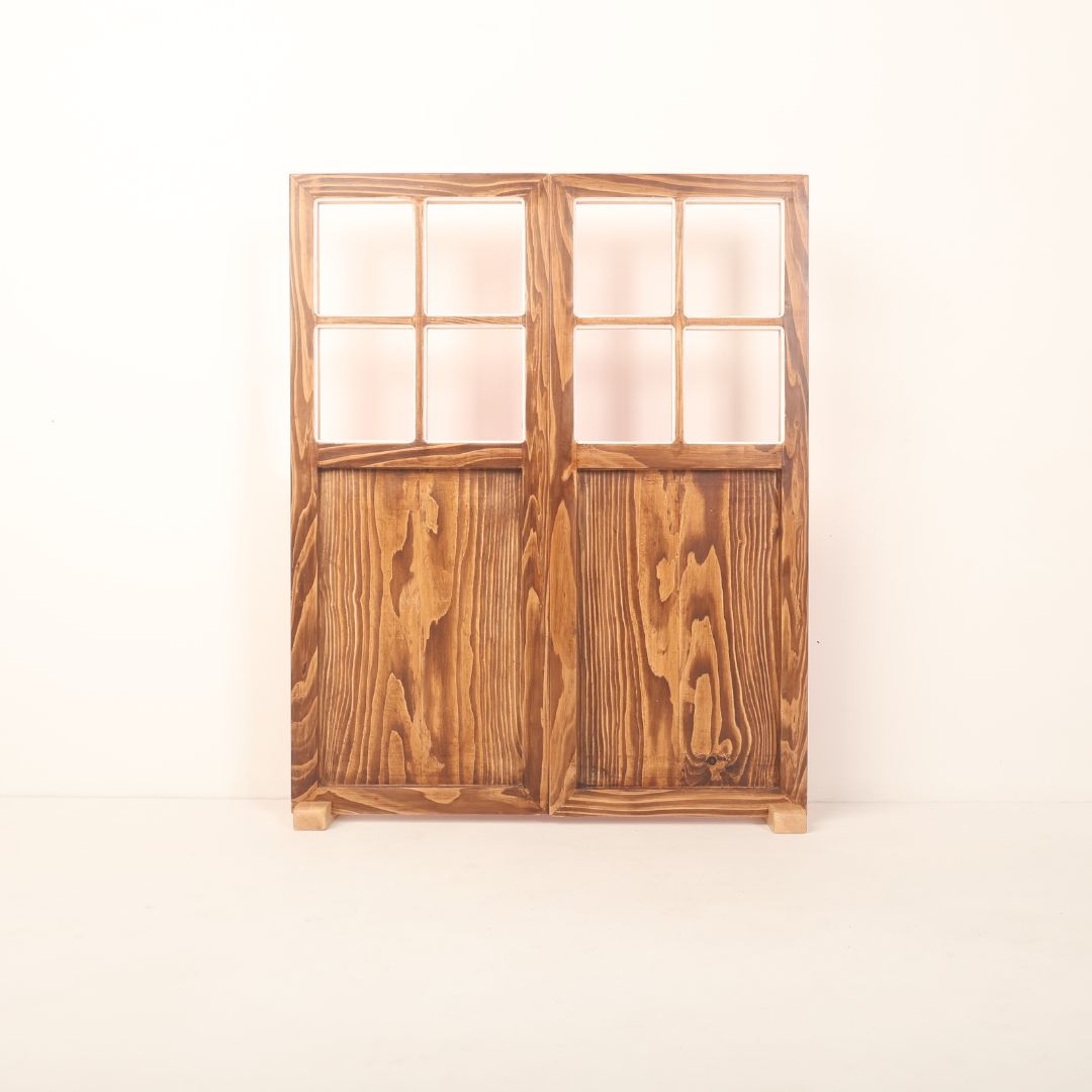 A dual-shade double leaf door prop with one side in wooden brown and the other in either red or white, designed for newborn, maternity, and event photography.