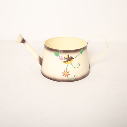 A garden sprinkler baby photoshoot prop, styled outdoors with floral decor, creating a whimsical theme for baby photography sessions.