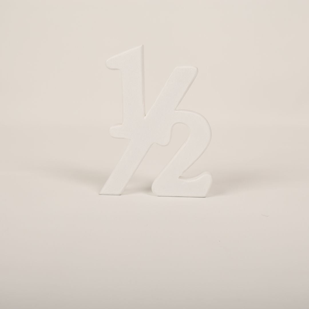 Adorable Half Birthday Prop showcasing '½' for six-month baby milestone photoshoots.