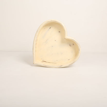 A wooden heart-shaped bowl designed as a prop for newborn baby photoshoots. The bowl has smooth edges and a natural wood finish, providing a cozy and charming setting to cradle a baby. Ideal for capturing heartfelt and memorable moments.