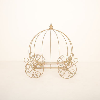 Golden metal carriage baby photoshoot prop with intricate design, perfect for fairytale and princess-themed photography.