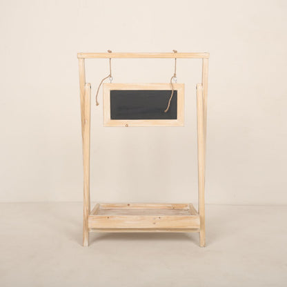 Wooden baby prop bed designed for newborn photoshoots, featuring a minimalist design with soft, cozy bedding for creating adorable and timeless setups.