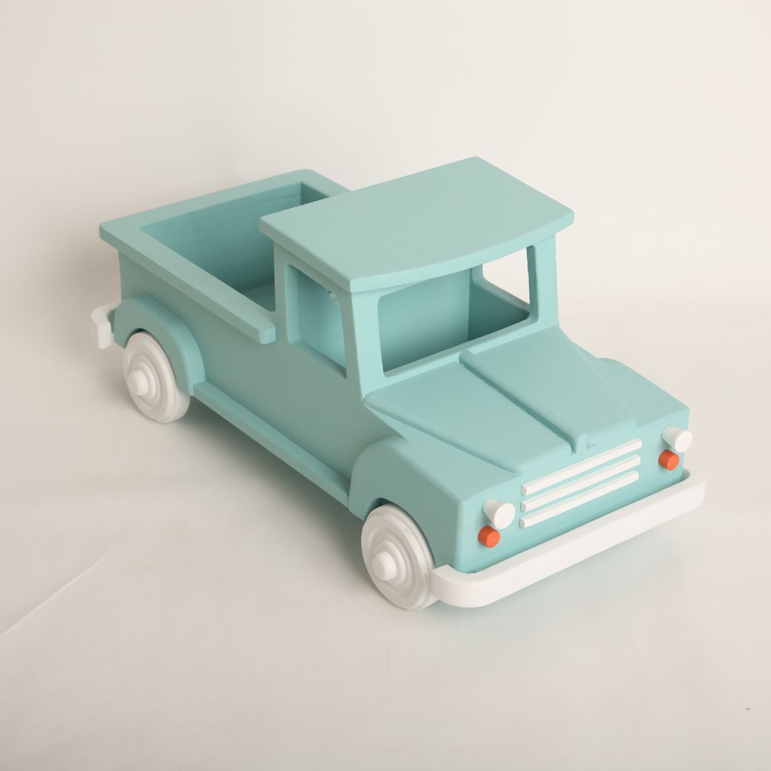  wooden truck baby prop designed for baby photoshoots. The truck features a vintage-inspired design with detailed wheels, a spacious cargo area, and a distressed finish. Perfect for creating adorable and unique photography setups for newborns and toddlers.