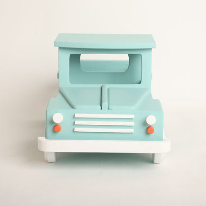  wooden truck baby prop designed for baby photoshoots. The truck features a vintage-inspired design with detailed wheels, a spacious cargo area, and a distressed finish. Perfect for creating adorable and unique photography setups for newborns and toddlers.