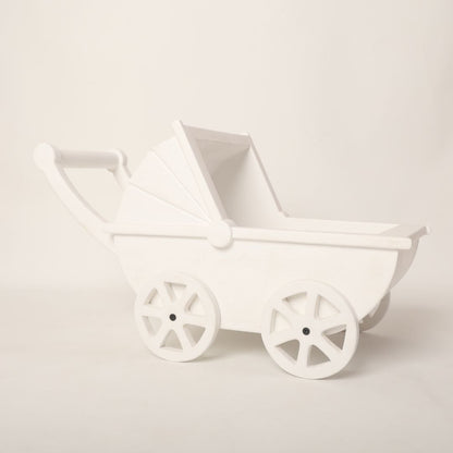 A vintage-style pram baby prop with soft pastel accents, designed for newborn photoshoots.
