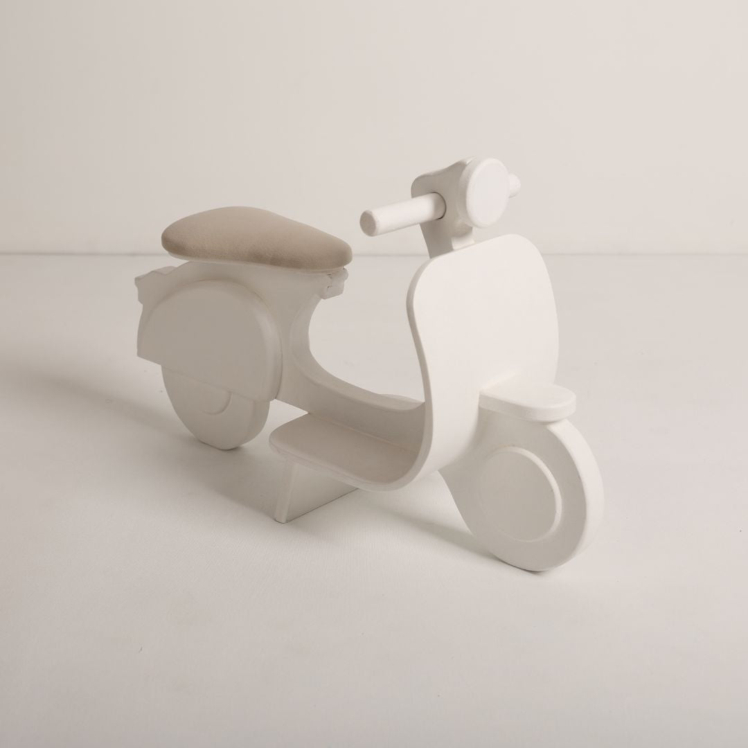 Adorable scooter baby photoshoot prop in vibrant colors, perfect for newborn and toddler photography setups.
