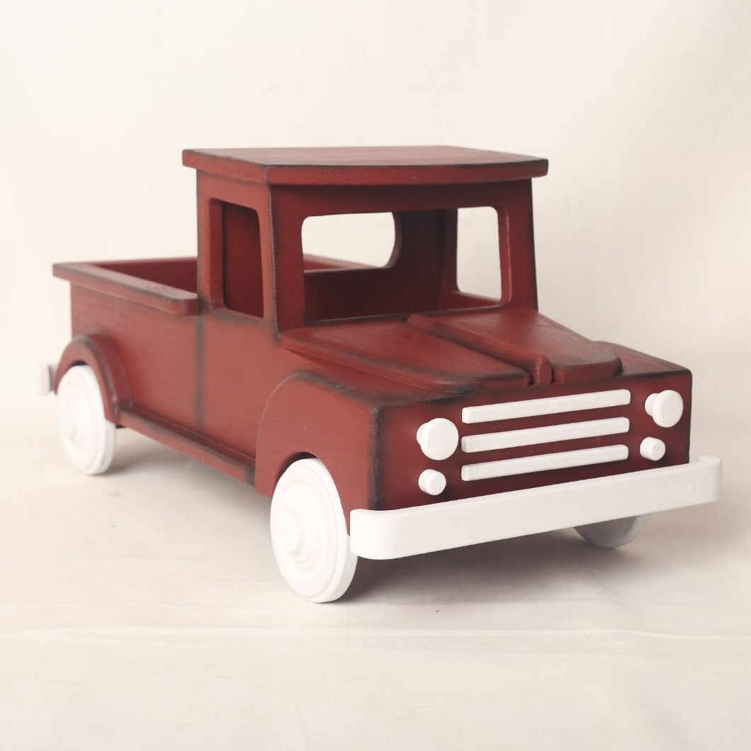  wooden truck baby prop designed for baby photoshoots. The truck features a vintage-inspired design with detailed wheels, a spacious cargo area, and a distressed finish. Perfect for creating adorable and unique photography setups for newborns and toddlers.