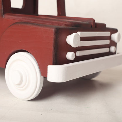  wooden truck baby prop designed for baby photoshoots. The truck features a vintage-inspired design with detailed wheels, a spacious cargo area, and a distressed finish. Perfect for creating adorable and unique photography setups for newborns and toddlers.