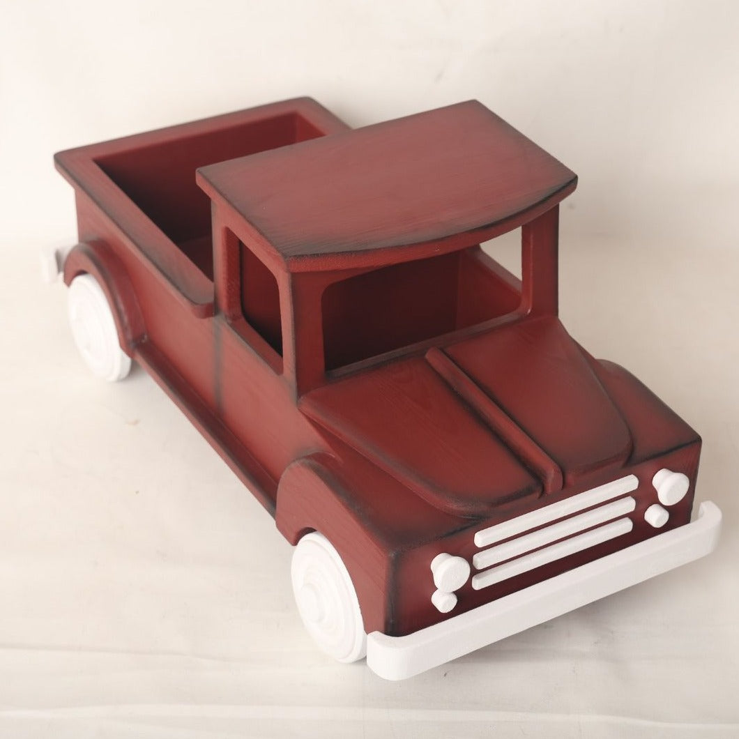  wooden truck baby prop designed for baby photoshoots. The truck features a vintage-inspired design with detailed wheels, a spacious cargo area, and a distressed finish. Perfect for creating adorable and unique photography setups for newborns and toddlers.
