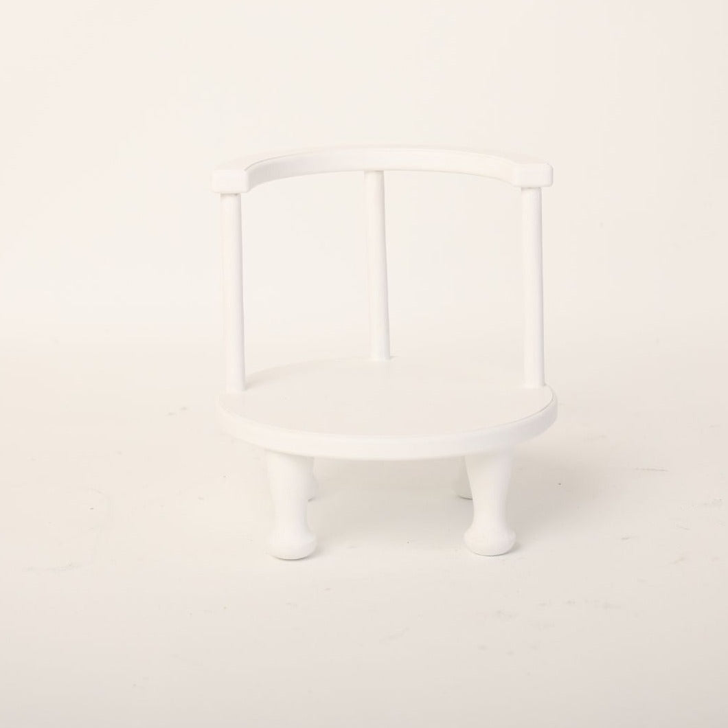This is a low chair baby prop for baby photoshoot.
