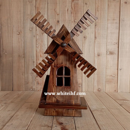Adorable windmill baby prop for newborn and toddler photoshoots, perfect for creating rustic and whimsical photography themes.