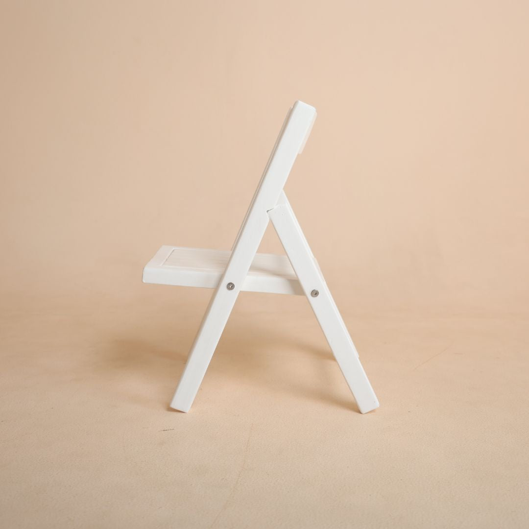 Toddler posing chair prop used in baby photography studio setup for premium shoots