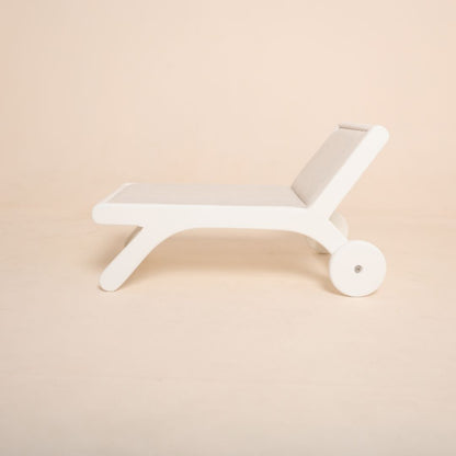 Wooden beach side bench baby photoshoot prop for seaside or summer photography theme setup.