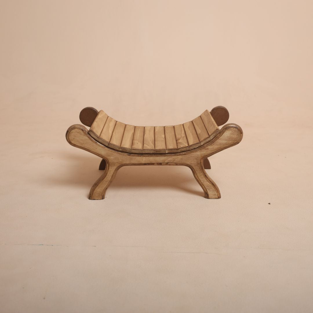 Brown wooden bench baby photoshoot prop with baby posing