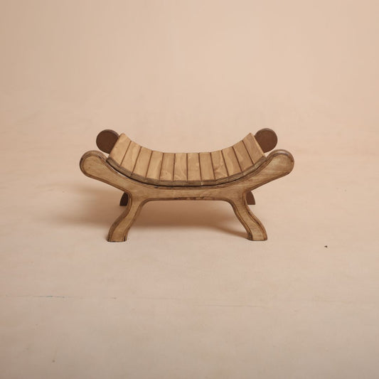 Brown wooden bench baby photoshoot prop with baby posing