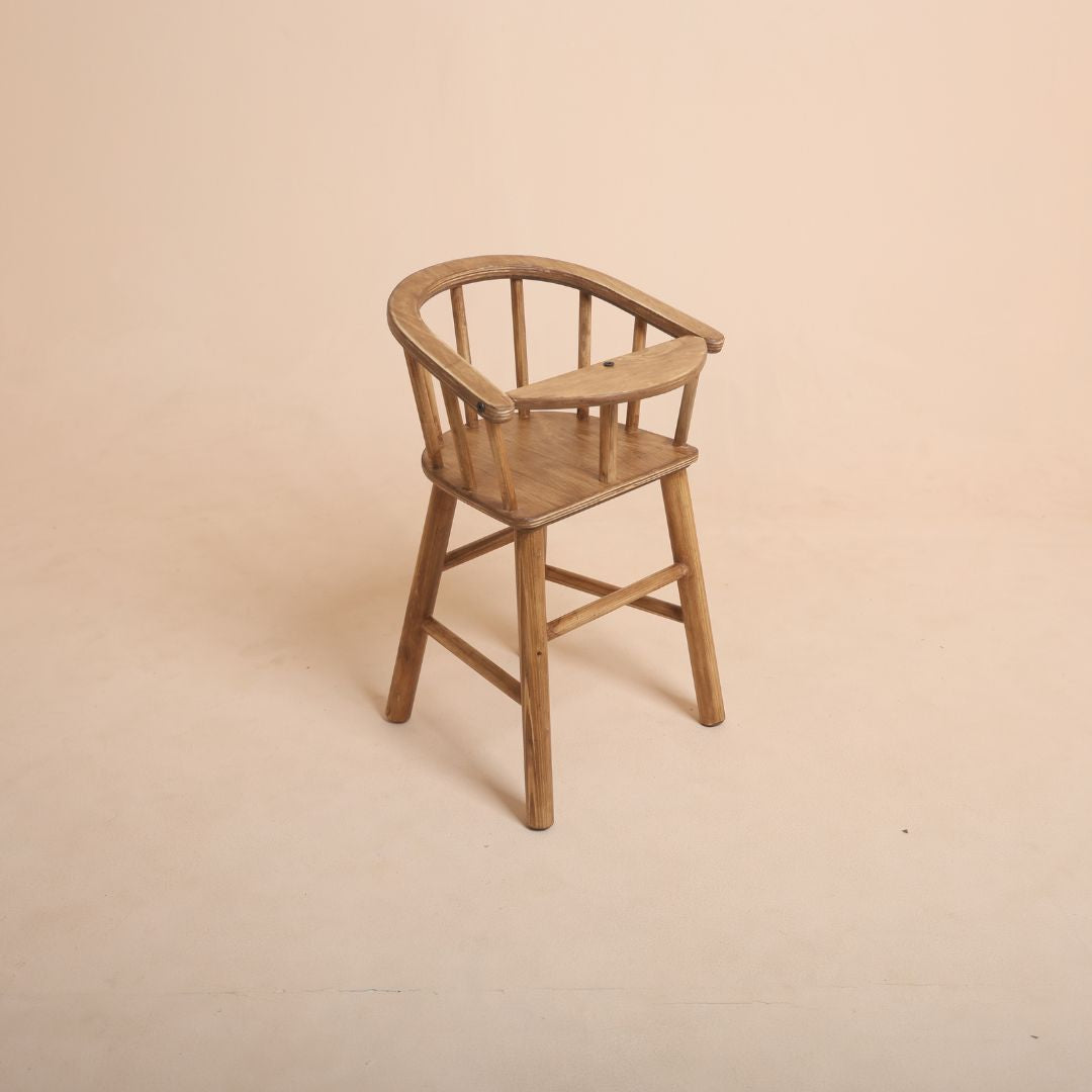 Brown wooden high chair baby photoshoot prop with baby sitting
