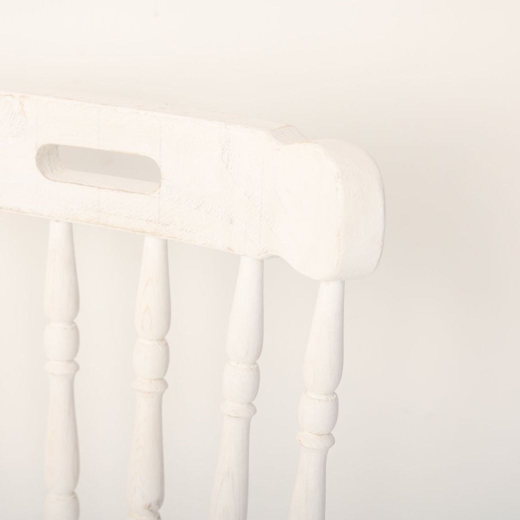 A stylish chair prop, ideal for photoshoots, featuring a classic design and neutral color scheme. The chair adds elegance and sophistication to any scene, making it a perfect accessory for professional photography sessions.