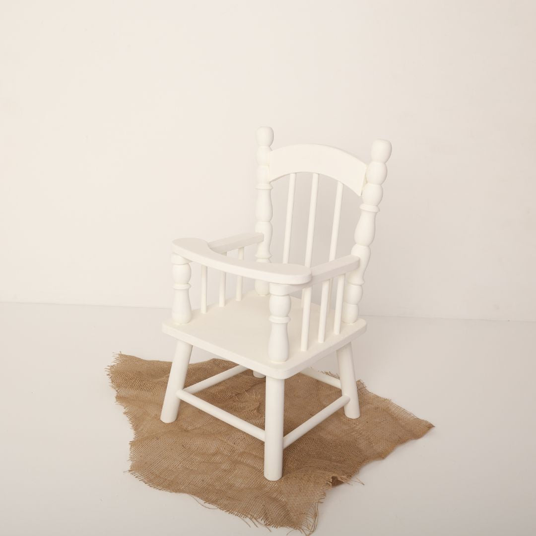 Elegant baby chair prop with arms, designed for newborn and sitter photoshoots, perfect for capturing charming and cozy baby portraits.