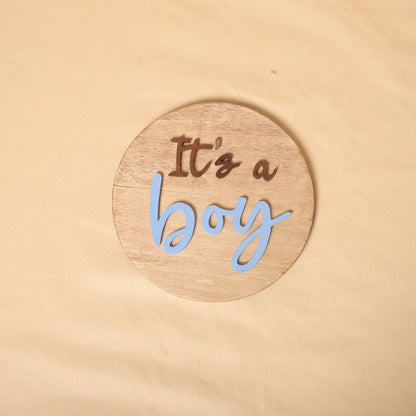 Gender reveal prop for maternity photoshoot featuring 'It's a Boy' and 'It's a Girl' signs, perfect for expecting mothers