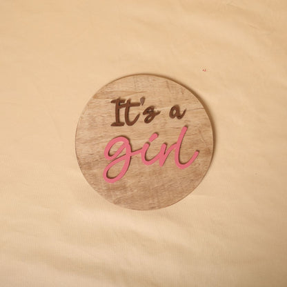 Gender reveal prop for maternity photoshoot featuring 'It's a Boy' and 'It's a Girl' signs, perfect for expecting mothers