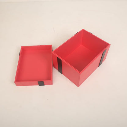 A beautifully crafted gift box baby prop, styled with ribbons and soft padding, ideal for newborn and sitter photoshoots, available at a baby prop store.