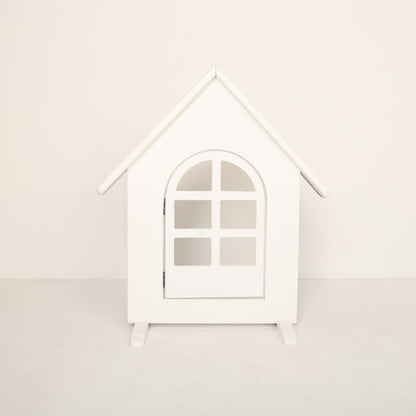 A wooden house-shaped baby prop styled for newborn photography, featuring rustic details perfect for a cottage-themed photoshoot.