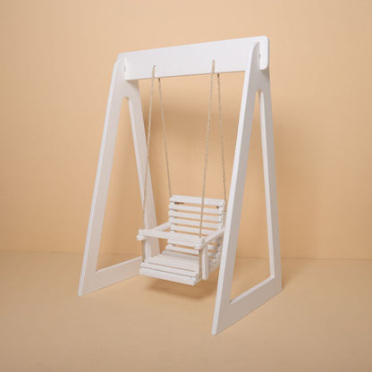 Krishna Janmashtami themed wooden swing baby photoshoot prop in festive setup