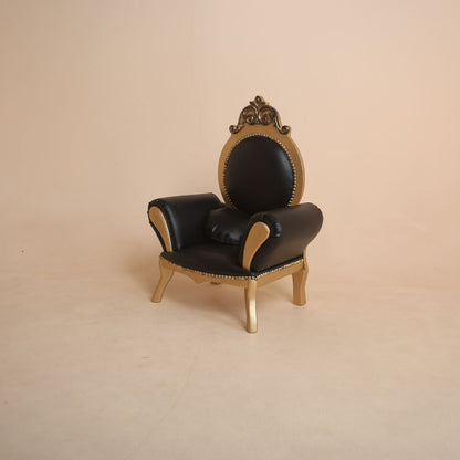Luxury black and gold baby sofa prop for premium photoshoot setup