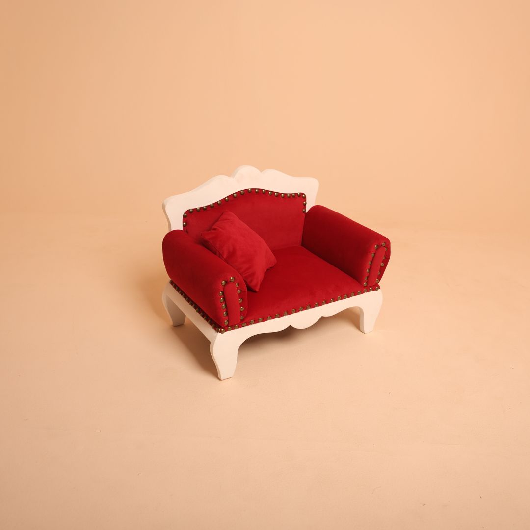 Red royal sofa baby prop for newborn and sitter photoshoots.