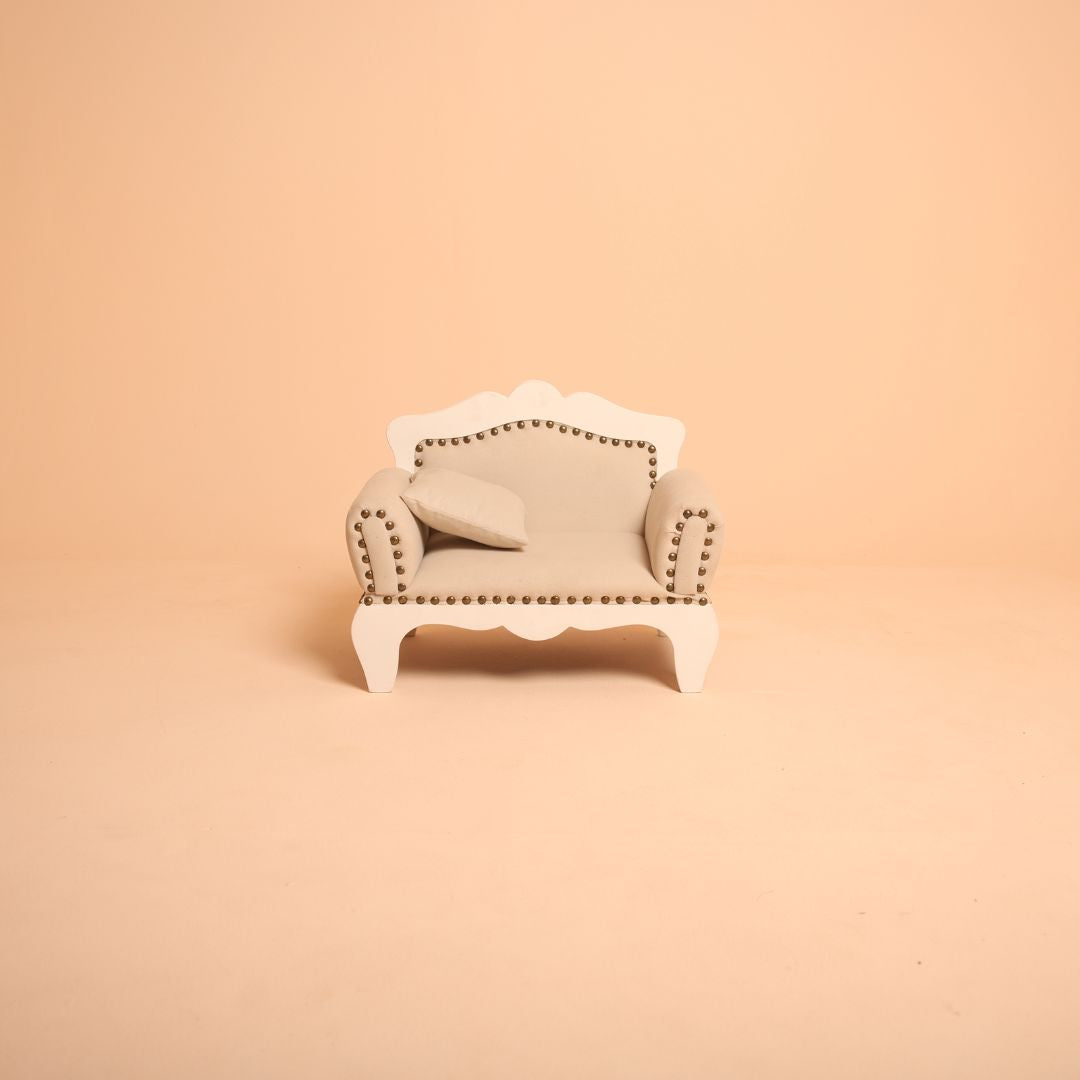 Elegant ivory white baby posing sofa for professional photography.