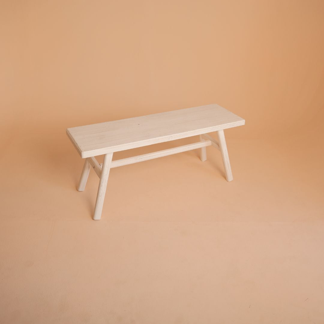 Rustic white wooden posing bench for baby and family photoshoots, styled for portraits and studio photography.
