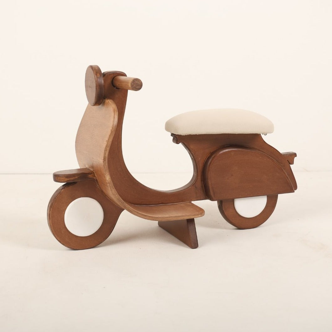 Adorable scooter baby photoshoot prop in vibrant colors, perfect for newborn and toddler photography setups.